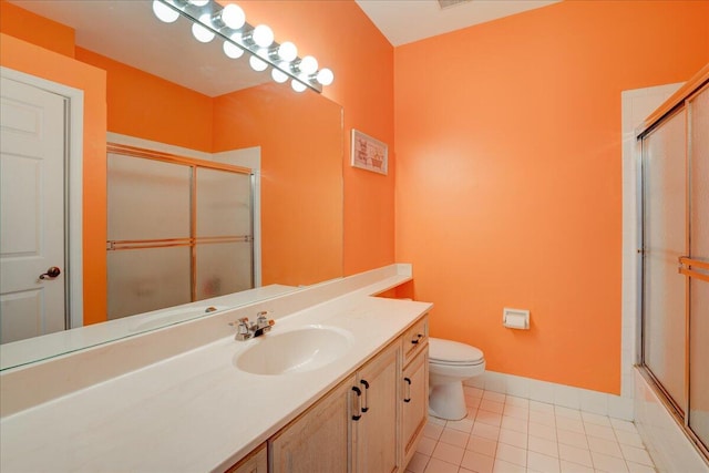 full bathroom featuring vanity, tile patterned flooring, toilet, and combined bath / shower with glass door