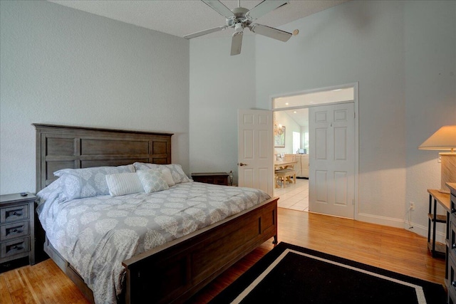 bedroom featuring light hardwood / wood-style flooring and ceiling fan