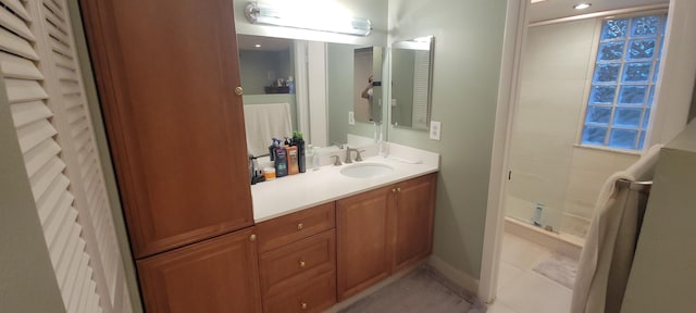 bathroom with vanity, tile patterned floors, and a shower with shower door