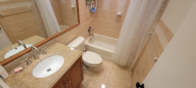 full bathroom with vanity, shower / tub combo with curtain, toilet, and tile patterned floors