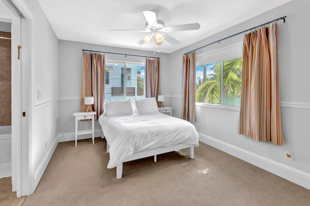 carpeted bedroom with ceiling fan