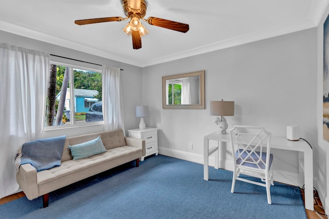 home office with ornamental molding, carpet, and ceiling fan