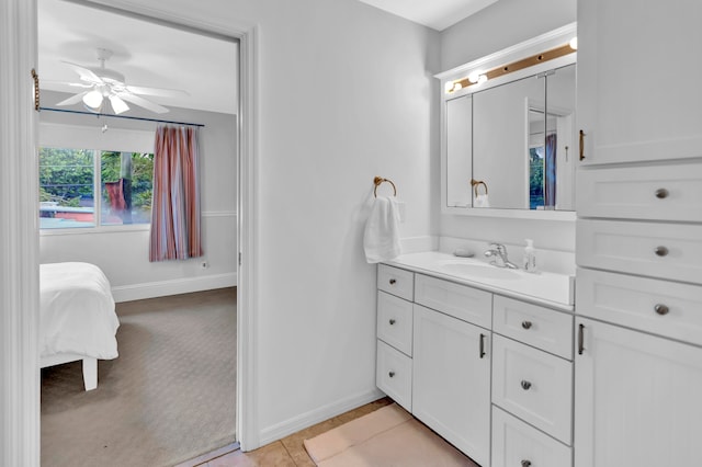 bathroom featuring ceiling fan, vanity, and tile patterned floors