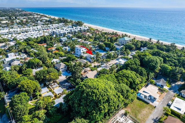 drone / aerial view featuring a view of the beach and a water view