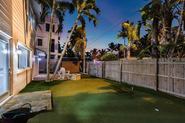 yard at dusk with a patio