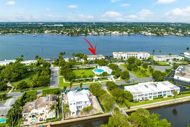 birds eye view of property with a water view