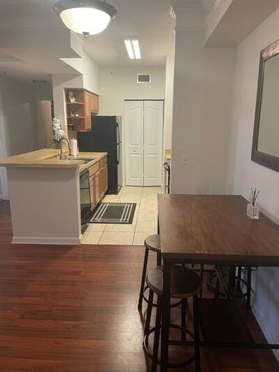 dining area featuring light hardwood / wood-style flooring and sink