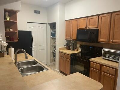 kitchen featuring black appliances and sink