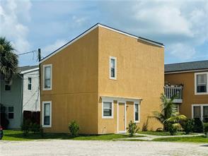 rear view of property with a balcony