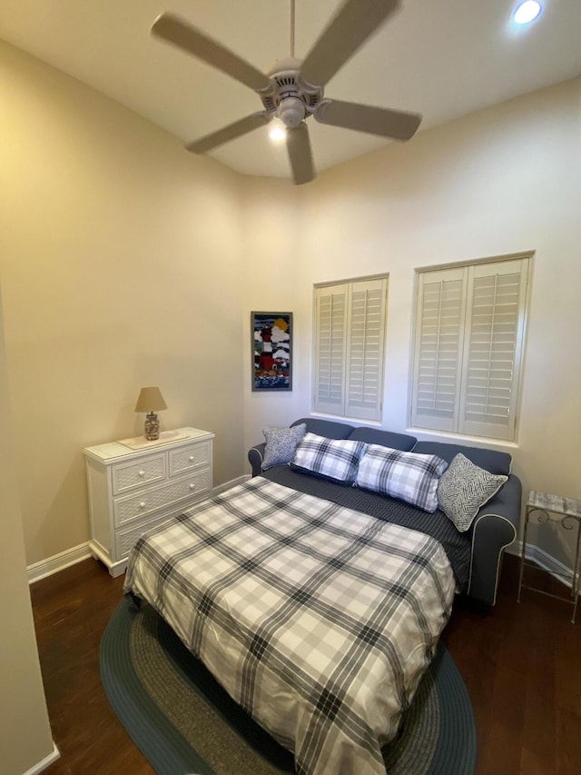 bedroom with ceiling fan and dark hardwood / wood-style flooring