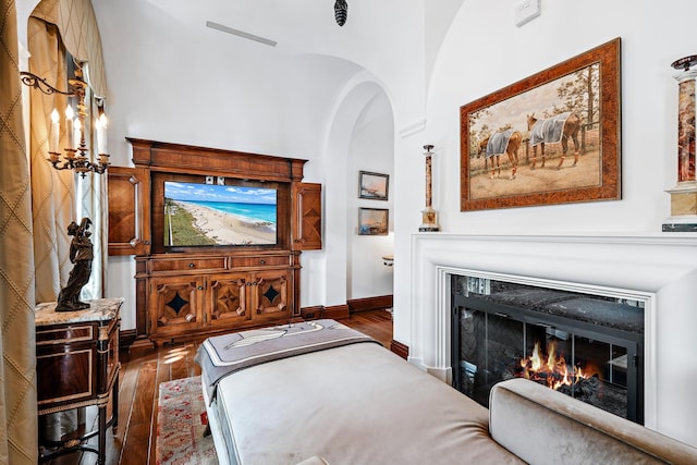 bedroom featuring vaulted ceiling and dark hardwood / wood-style floors