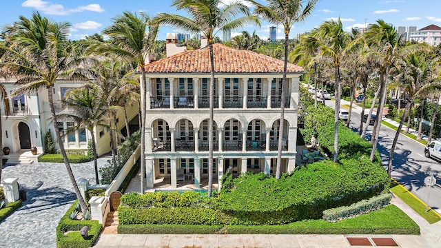 rear view of property featuring a balcony