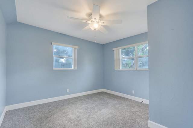 empty room featuring carpet and ceiling fan