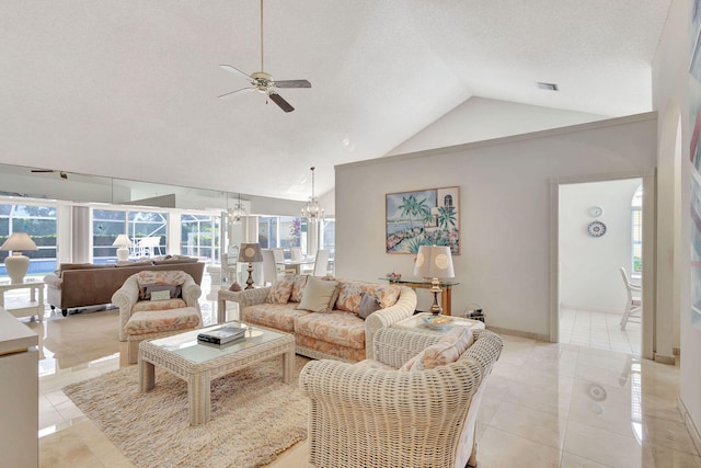 tiled living room with ceiling fan with notable chandelier, a textured ceiling, and high vaulted ceiling