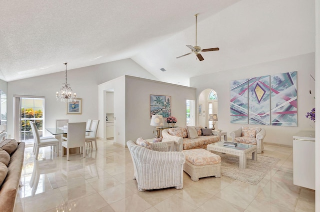 living room with a textured ceiling, ceiling fan with notable chandelier, and high vaulted ceiling