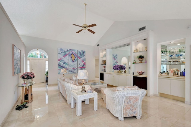 living room with ceiling fan, light tile patterned flooring, built in features, and high vaulted ceiling