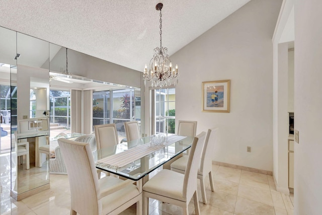 dining area featuring a textured ceiling, ceiling fan with notable chandelier, light tile patterned flooring, and high vaulted ceiling