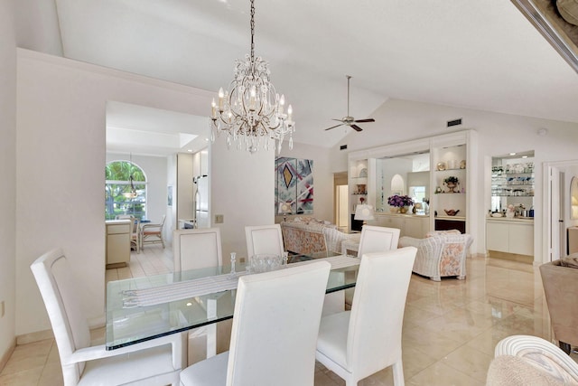 dining area with ceiling fan with notable chandelier and lofted ceiling