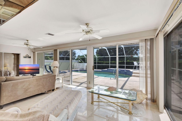 sunroom with ceiling fan