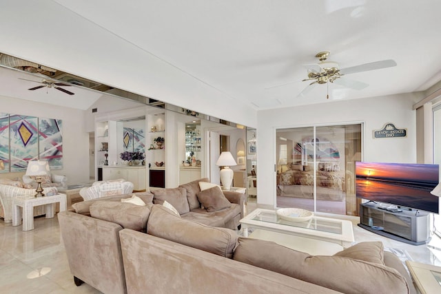 tiled living room with ceiling fan