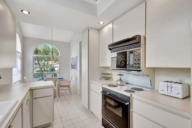 kitchen featuring white appliances, pendant lighting, and white cabinets