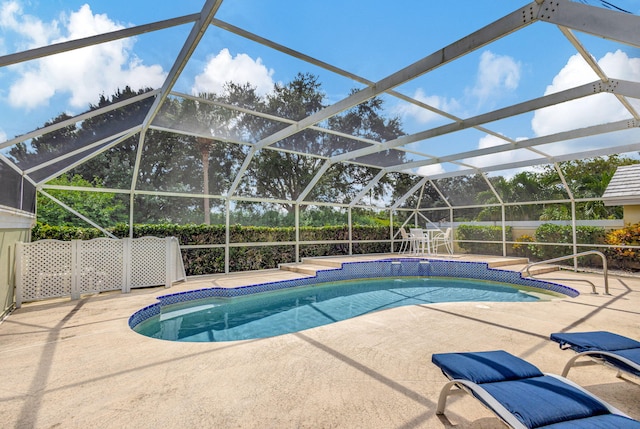 view of swimming pool with a patio and a lanai