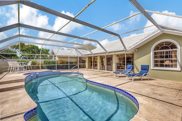 view of pool featuring a lanai and a patio