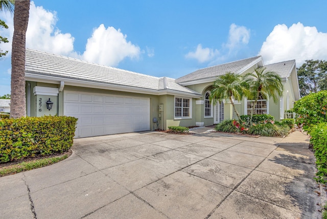 single story home with a garage