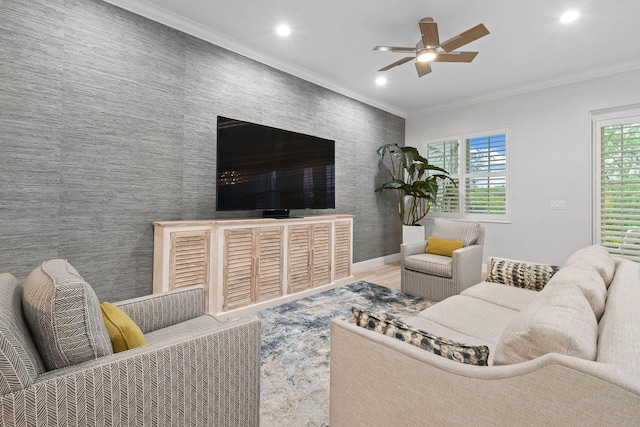 living room featuring ceiling fan and ornamental molding