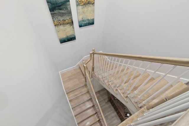 stairs with hardwood / wood-style flooring