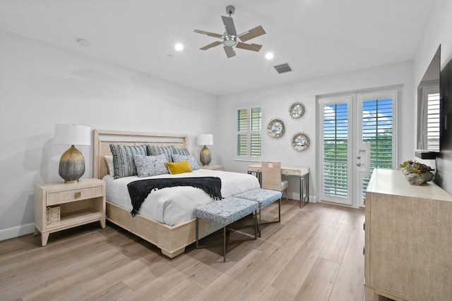 bedroom featuring light hardwood / wood-style floors, ceiling fan, and access to outside