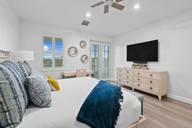 bedroom featuring ceiling fan, light hardwood / wood-style floors, and access to outside