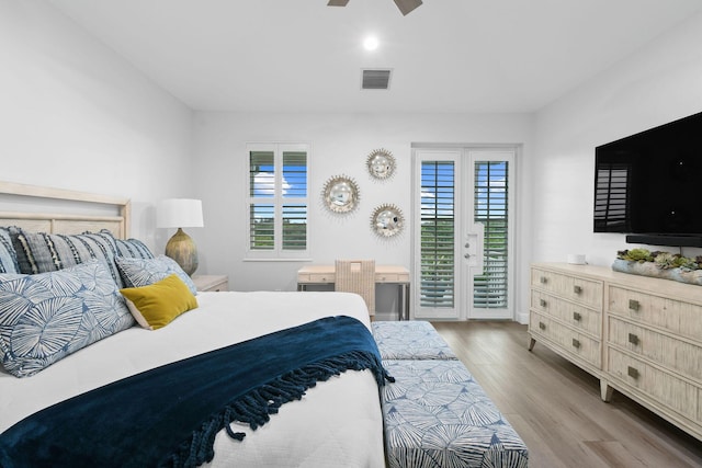 bedroom with ceiling fan, light hardwood / wood-style flooring, and access to outside