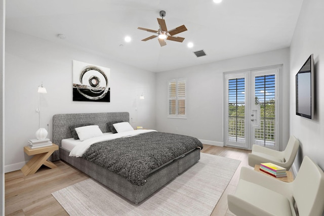 bedroom featuring ceiling fan, access to outside, and light wood-type flooring