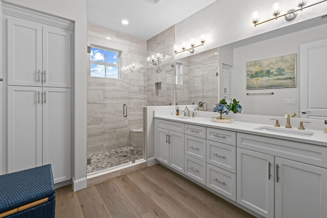 bathroom featuring vanity, hardwood / wood-style floors, and an enclosed shower