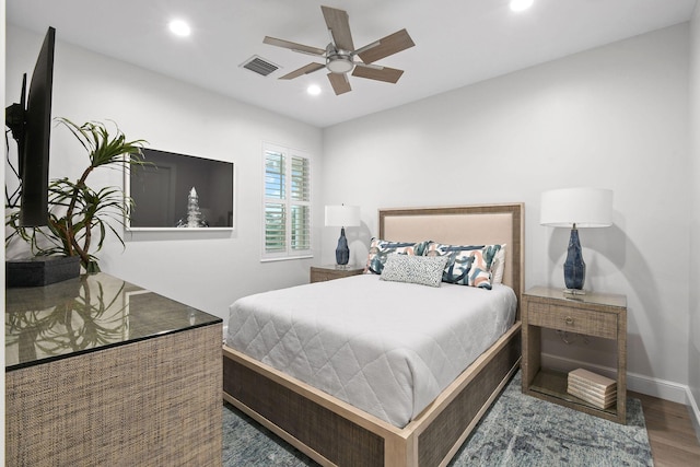 bedroom featuring dark hardwood / wood-style floors and ceiling fan