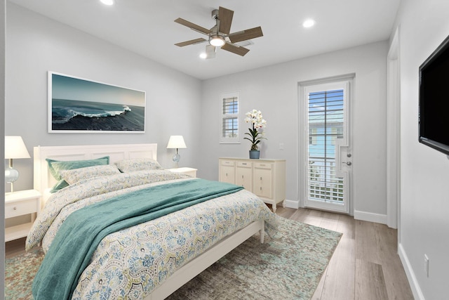 bedroom featuring ceiling fan, light hardwood / wood-style flooring, and access to exterior