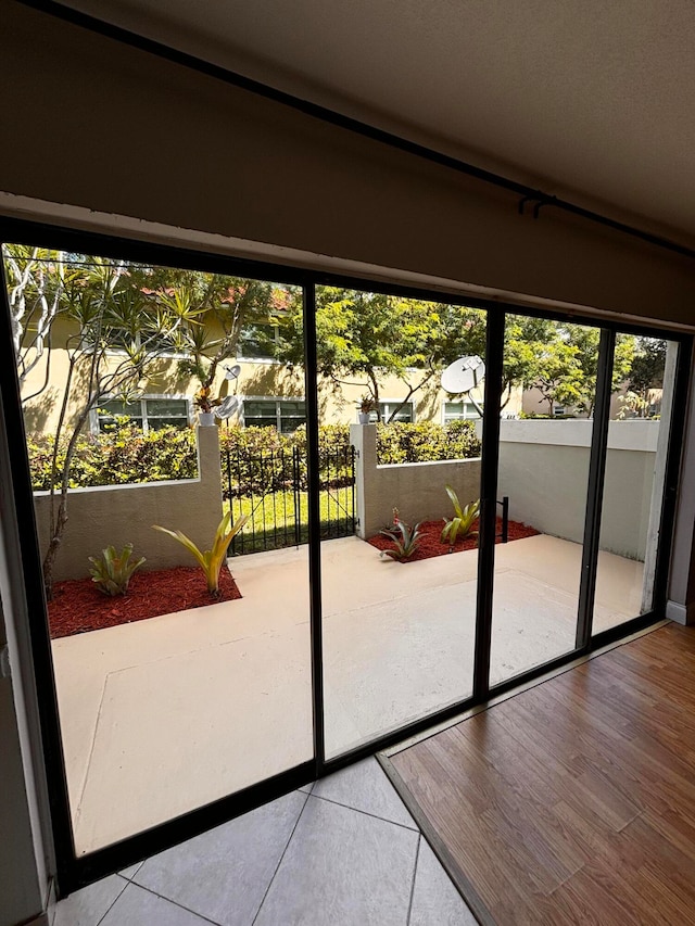 entryway with hardwood / wood-style flooring