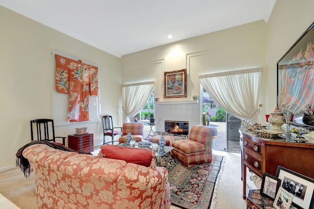 living room with light colored carpet and a fireplace