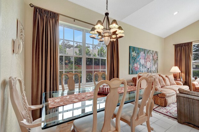 dining room featuring light tile patterned flooring, recessed lighting, lofted ceiling, and a chandelier