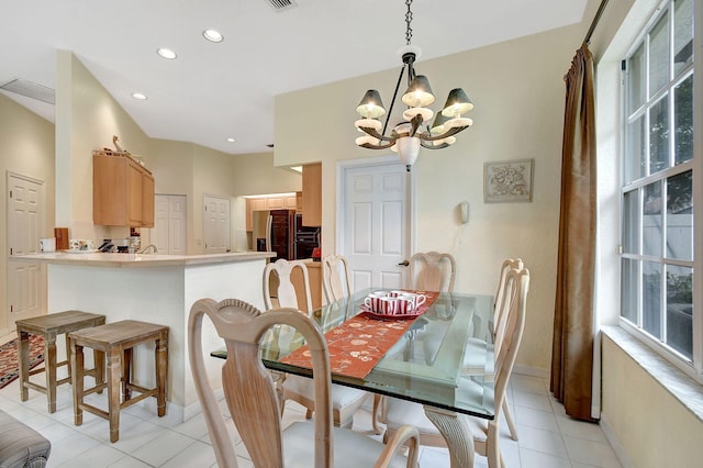 dining area featuring light tile patterned floors, recessed lighting, a notable chandelier, and baseboards
