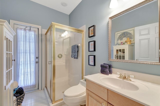 bathroom with toilet, a stall shower, tile patterned floors, and vanity
