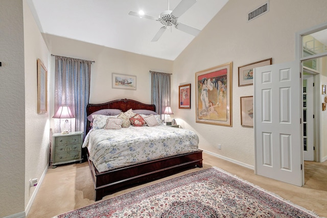 bedroom featuring light colored carpet, visible vents, high vaulted ceiling, and a textured wall