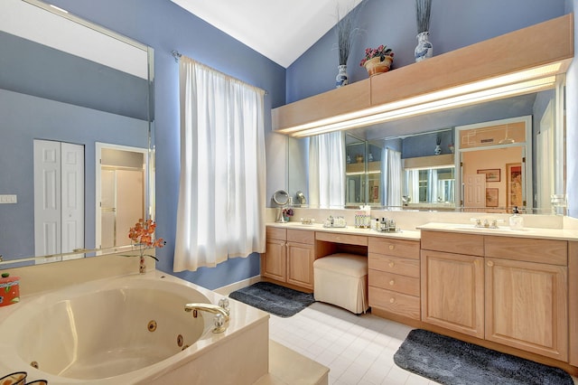 bathroom with a whirlpool tub, tile patterned floors, a shower stall, vanity, and lofted ceiling