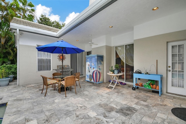 view of patio / terrace featuring a grill and ceiling fan