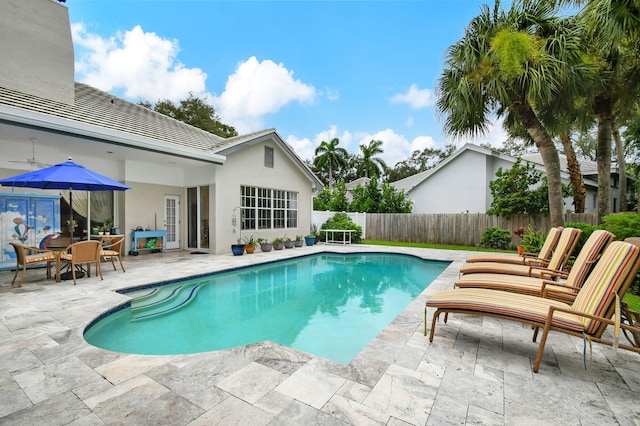view of pool featuring a fenced in pool, a patio area, and a fenced backyard