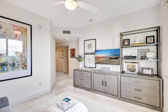 living room featuring ceiling fan