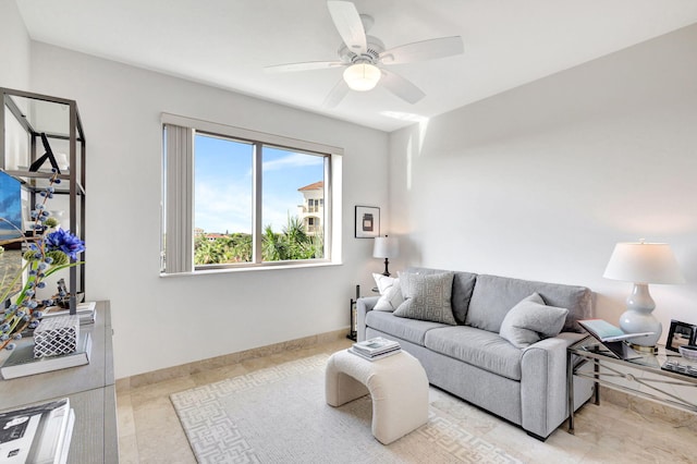 living room featuring ceiling fan and light tile patterned flooring