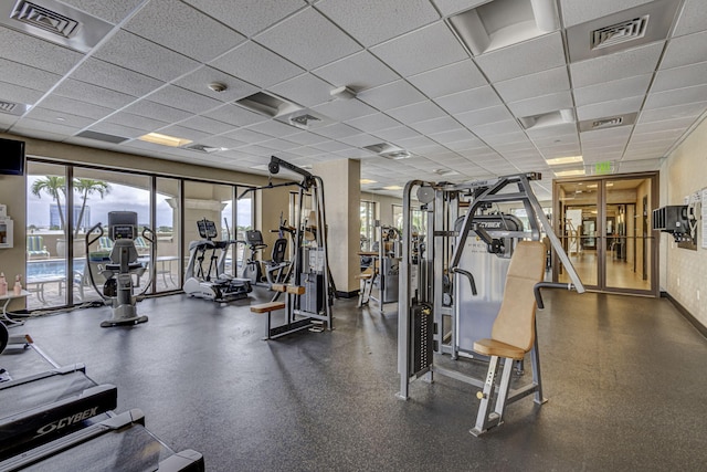 gym featuring a drop ceiling