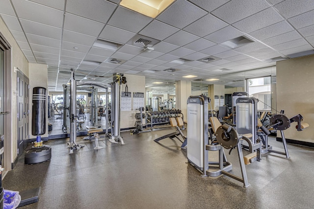 exercise room with a drop ceiling